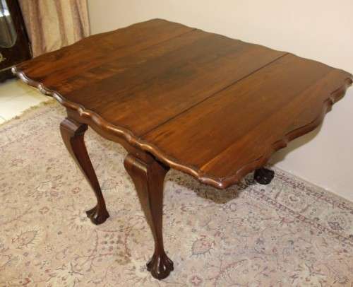 A fabulous stylish vintage drop leaf occasional table with oversized ball and claw feet. Stunning!!!