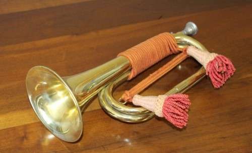 A fantastic ornate vintage brass military bugle with orange rope & tassel. Lifespace Sale