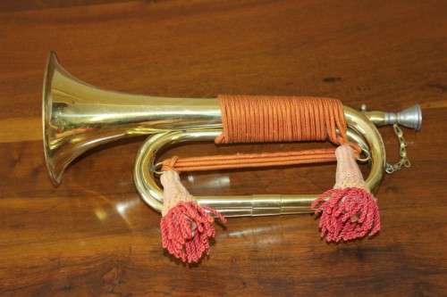 A fantastic ornate vintage brass military bugle with orange rope & tassel. Lifespace Sale