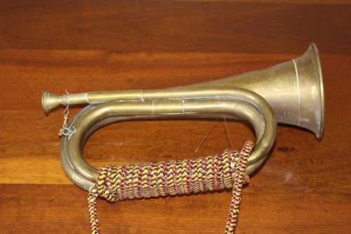 A fabulous vintage brass military bugle with colourful rope & tassel.  Lifespace Sale
