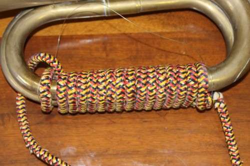 A fabulous vintage brass military bugle with colourful rope & tassel.  Lifespace Sale