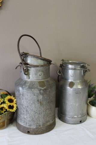 A pair of vintage metal cream/ milk canisters (2 gallon/5ltr) with loads of charm & character.