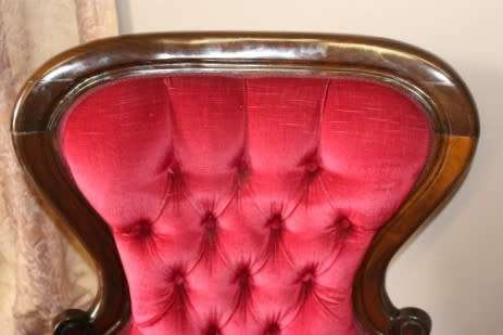 An elegant pair of antique Victorian styled arm chairs w/ button detailing & gorgeous fabric.