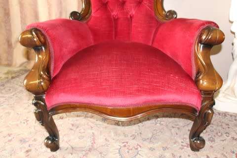 An elegant pair of antique Victorian styled arm chairs w/ button detailing & gorgeous fabric.