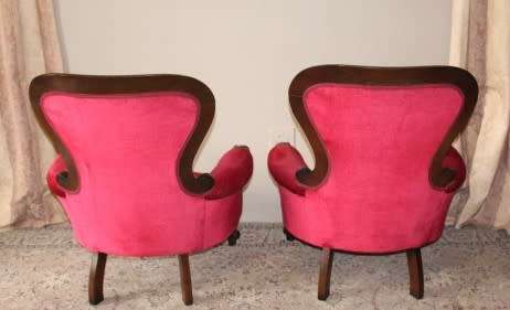 An elegant pair of antique Victorian styled arm chairs w/ button detailing & gorgeous fabric.