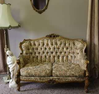 An exquisite Victorian 2 seater couch w carved detailing & period style floral upholstery. Beautiful