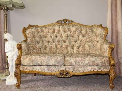 An exquisite Victorian 2 seater couch w carved detailing & period style floral upholstery. Beautiful