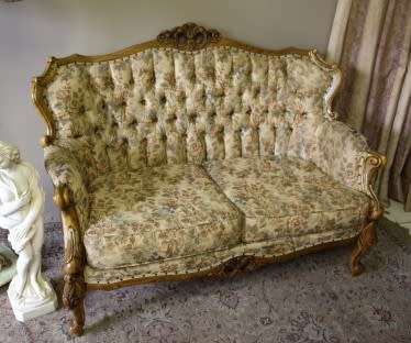 An exquisite Victorian 2 seater couch w carved detailing & period style floral upholstery. Beautiful