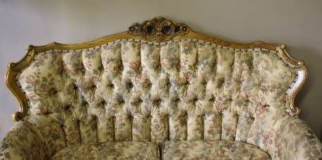 An exquisite Victorian 2 seater couch w carved detailing & period style floral upholstery. Beautiful