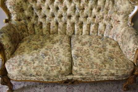An exquisite Victorian 2 seater couch w carved detailing & period style floral upholstery. Beautiful