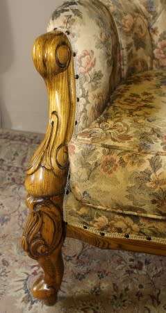 An exquisite Victorian 2 seater couch w carved detailing & period style floral upholstery. Beautiful