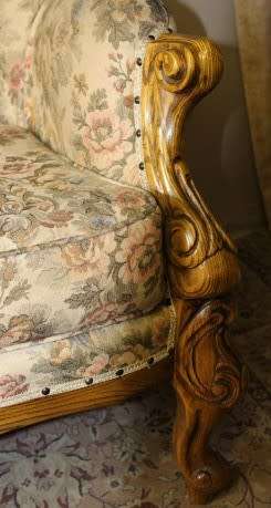 An exquisite Victorian 2 seater couch w carved detailing & period style floral upholstery. Beautiful