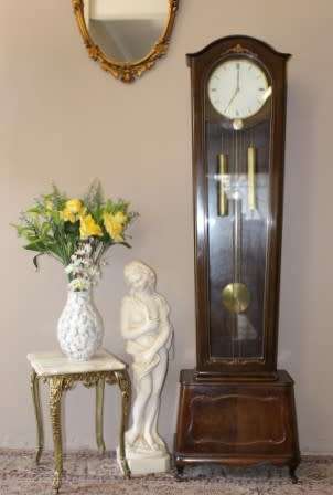 An exquisite Art Deco 1950's German made Junghans weight driven "Granddaughter" clock w/ enamel face