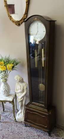 An exquisite Art Deco 1950's German made Junghans weight driven "Granddaughter" clock w/ enamel face