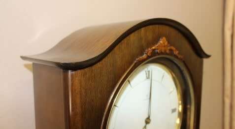 An exquisite Art Deco 1950's German made Junghans weight driven "Granddaughter" clock w/ enamel face