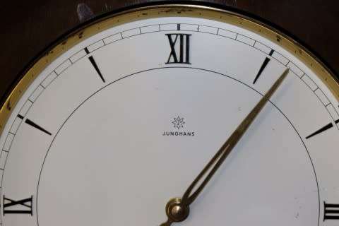 An exquisite Art Deco 1950's German made Junghans weight driven "Granddaughter" clock w/ enamel face