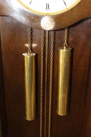 An exquisite Art Deco 1950's German made Junghans weight driven "Granddaughter" clock w/ enamel face