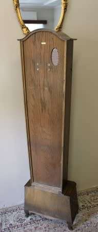 An exquisite Art Deco 1950's German made Junghans weight driven "Granddaughter" clock w/ enamel face