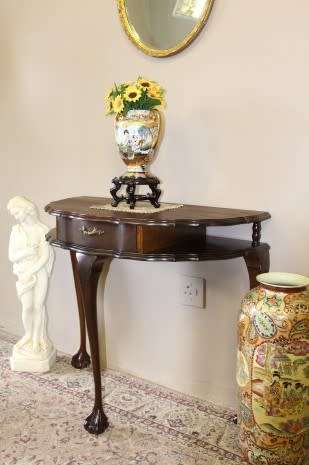 A beautiful vintage Imbuia scalloped edge Ball & claw half moon display/occasional table w/ a drawer
