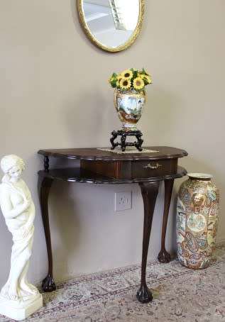 A beautiful vintage Imbuia scalloped edge Ball & claw half moon display/occasional table w/ a drawer