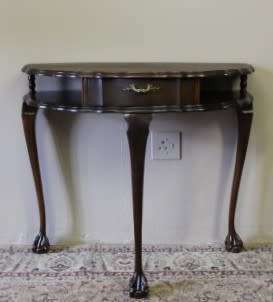 A beautiful vintage Imbuia scalloped edge Ball & claw half moon display/occasional table w/ a drawer