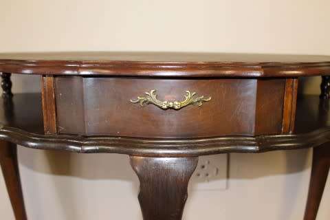 A beautiful vintage Imbuia scalloped edge Ball & claw half moon display/occasional table w/ a drawer