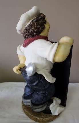 A magnificent hand crafted resin mold, hand painted menu holding chef statue. Amazing display piece