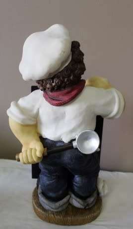 A magnificent hand crafted resin mold, hand painted menu holding chef statue. Amazing display piece