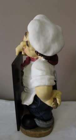 A magnificent hand crafted resin mold, hand painted menu holding chef statue. Amazing display piece