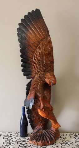 An exquisite, tall hand carved, detailed free standing wood eagle. Stunning feature display piece!
