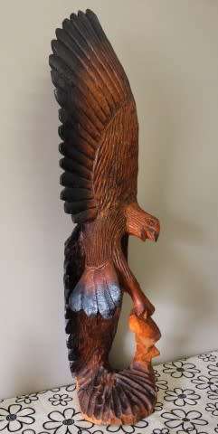 An exquisite, tall hand carved, detailed free standing wood eagle. Stunning feature display piece!