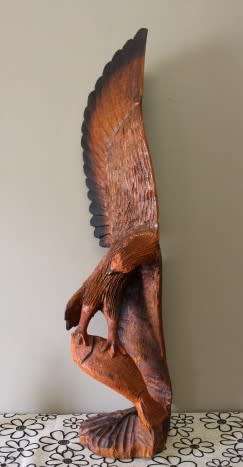 An exquisite, tall hand carved, detailed free standing wood eagle. Stunning feature display piece!