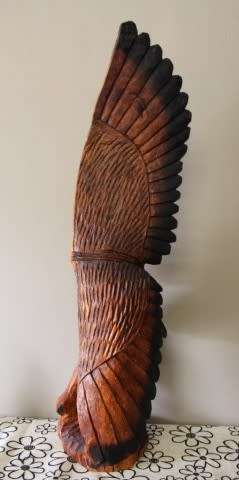 An exquisite, tall hand carved, detailed free standing wood eagle. Stunning feature display piece!