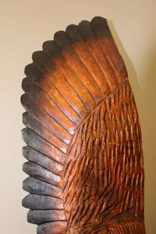 An exquisite, tall hand carved, detailed free standing wood eagle. Stunning feature display piece!