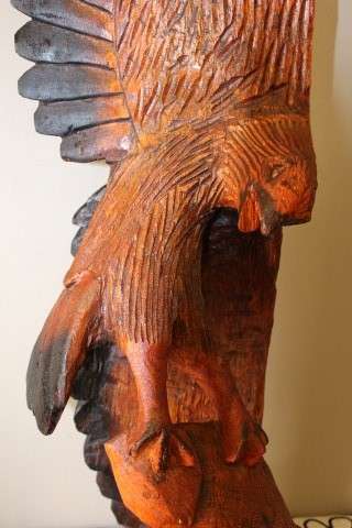 An exquisite, tall hand carved, detailed free standing wood eagle. Stunning feature display piece!