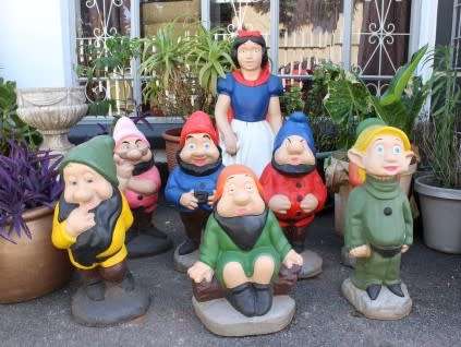A fantastic concrete garden set of Snow white and the seven dwarfs, cheerful, colourful and bright.