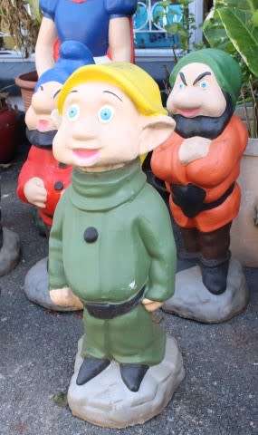 A fantastic concrete garden set of Snow white and the seven dwarfs, cheerful, colourful and bright.