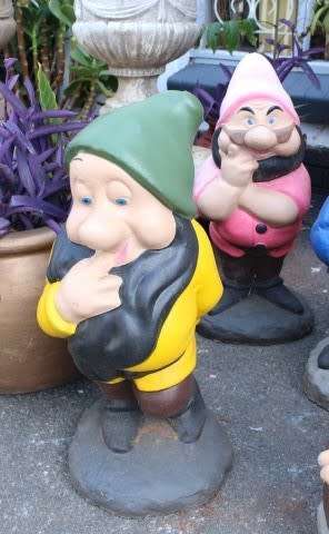 A fantastic concrete garden set of Snow white and the seven dwarfs, cheerful, colourful and bright.