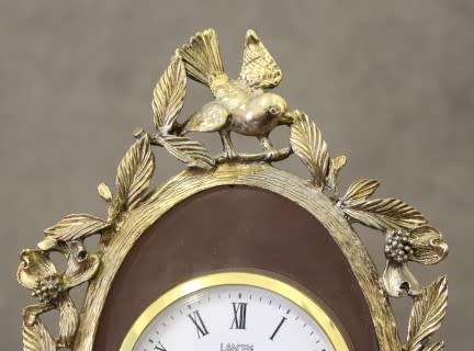 A beautiful vintage Japanese brass "Landex" wind up alarm clock with cherubs, working.