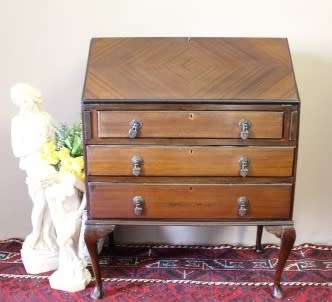 An elegant vintage fall-top writing bureau with pigeon holes and three spacious drawers. Beautiful!!