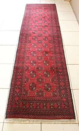 A stunning vintage Persian Afghan Bokara runner carpet (279cm long) in good condition. Fabulous!!!