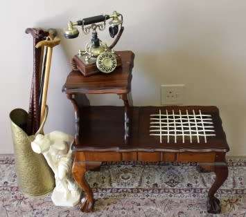 A gorgeous Imbuia ball and claw telephone table with riempies and storage under the seat.