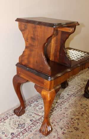 A gorgeous Imbuia ball and claw telephone table with riempies and storage under the seat.