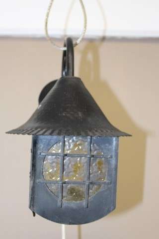 A lovely rustic black metal single wall fitted light, perfect in informal living areas.