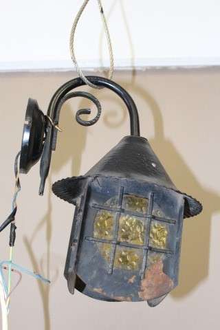 A lovely rustic black metal single wall fitted light, perfect in informal living areas.