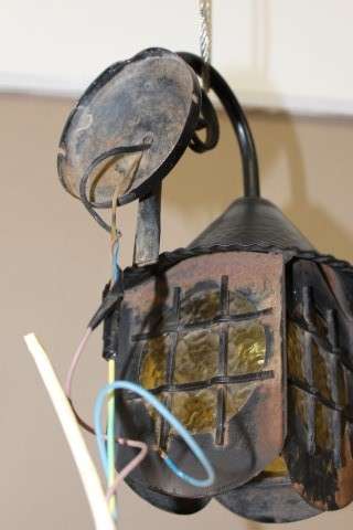 A lovely rustic black metal single wall fitted light, perfect in informal living areas.