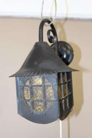 A lovely rustic black metal single wall fitted light, perfect in informal living areas.