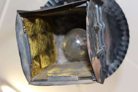 A lovely rustic black metal single wall fitted light, perfect in informal living areas.