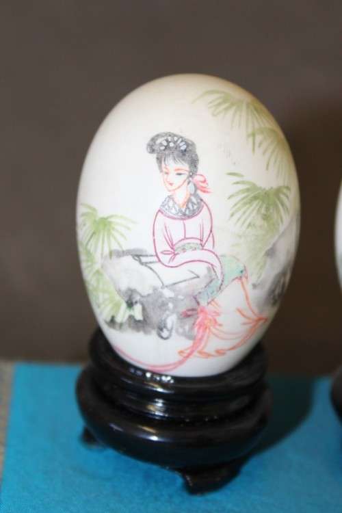 Three stunning hand painted Oriental themed egg ornaments on wooden stands, stunning in a collection