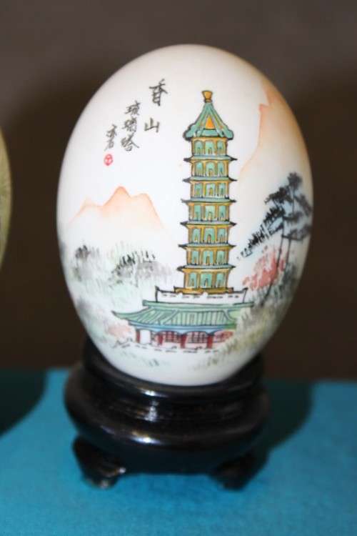 Three stunning hand painted Oriental themed egg ornaments on wooden stands, stunning in a collection